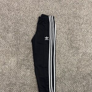 Adidas Woman’s Black Joggers with White Stripes